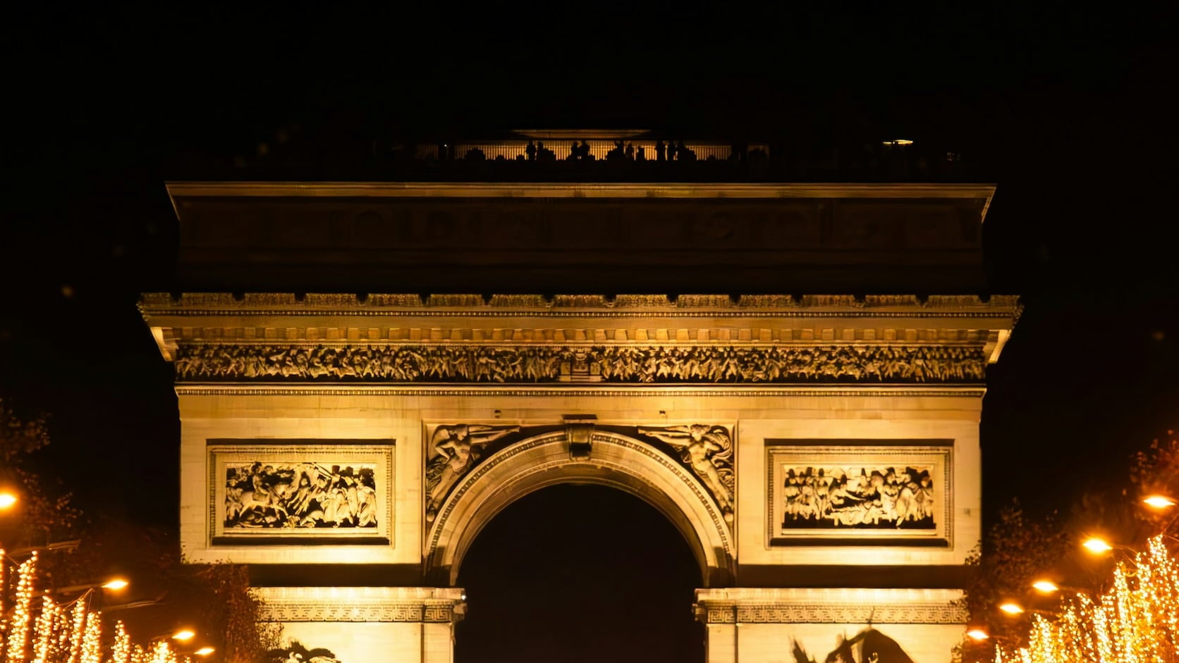 Arc de Triomphe lit at night, Paris